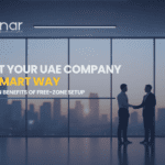 Business professionals shaking hands in a modern Dubai office overlooking the skyline, representing UAE free zone company setup and business formation.