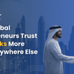 Two businessmen shaking hands in front of the Dubai skyline, representing why global entrepreneurs trust UAE corporate banking and financial stability.